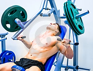 Bodybuilder with simulator