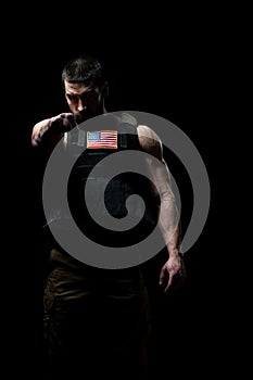 Bodybuilder Soldier With Bulletproof Vest on Black Background