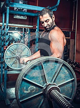 Bodybuilder in training room