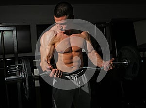 Bodybuilder training with weights