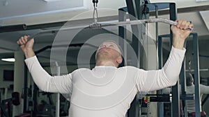 Bodybuilder trains in the gym