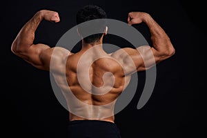 Bodybuilders training program. back view photo