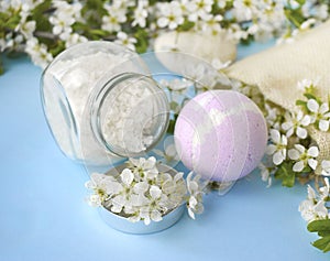 Bodycare cosmetic composition with spa ball, sea salt and spring blossom.