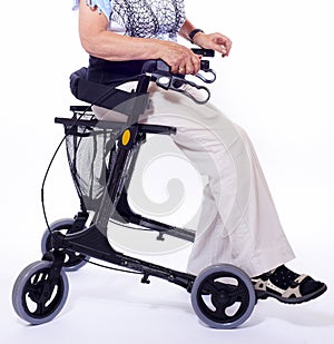 Bodypart of elderly woman sitting on walker