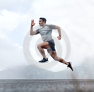 The bodys capable of anything when the mind is strong. Full length shot of a handsome young man jumping during a workout