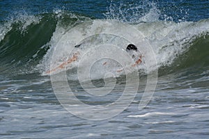Bodysurfers Catching a Wave