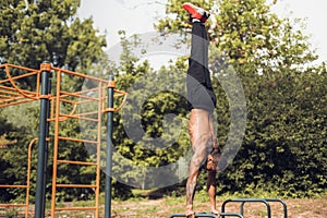 Bodyweight Exercise. Man Standing On Hands And Doing Push Ups