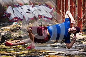 Bodyweight Training Man Standing on Hands in Warehouse