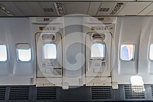 Boeing 737-800 Emergency Exit close-up in the middle of the passenger cabin