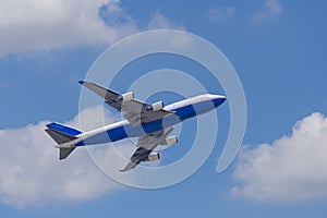 Boeing 747-400 airplane againt blue sky