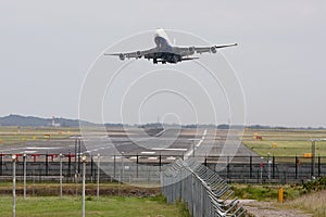 Boeing 747 jumbo jet taking off photo