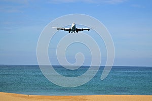 Boeing 777 landing on the tropical island of