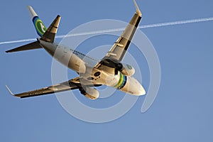 Boeing 737-700 on a blue sky.