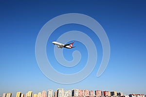 Boeing 737-800 of Turkish Airlines shown over Istanbul city, landing at Ataturk international airport.