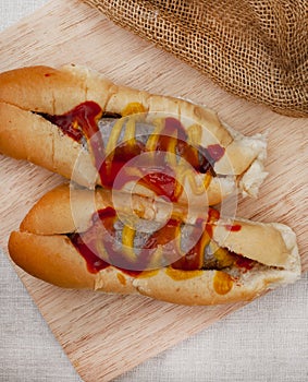 boerie rolls with tomato sauce and mustard