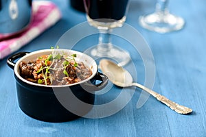 Boeuf bourguignon classic french beef stew on blue table with a
