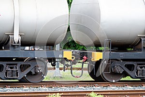 The bogie of the oil tanker in the freight train is parked in the railway yard