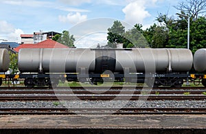 The bogie of the oil tanker in the freight train is parking in the railway yard