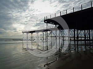 Bognor Regis Pier and reflections on the sand