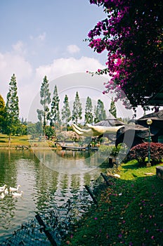 Bogor, Indonesia - A view of the flower themed park Taman Bunga Nusantara in a cloudy afternoon with a view to a green water lake