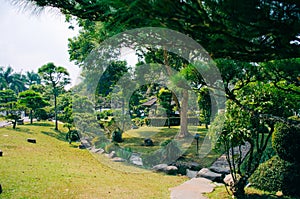 Bogor, Indonesia - A view of the flower themed park Taman Bunga Nusantara in a cloudy afternoon with a view to a replica of a photo