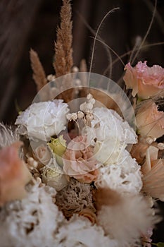 Boho bridal bouquet. White and peach wedding bouquet.