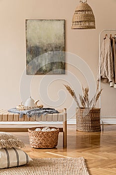 Earth tones living room interior with wooden furnitures and rattan natural decorations. photo