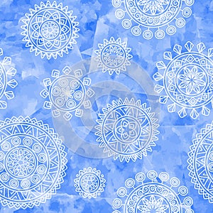 Boho ethnic seamless pattern with tribal elements. Hand drawn geometric mandalas on blue watercolor background.