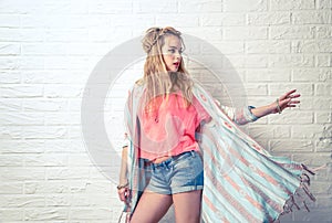 Boho Fashion Girl at White Brick Wall Background