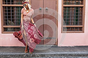 Boho girl walking on the city street