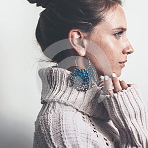 Boho jewelry and woolen sweater on model