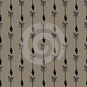 Boho stylized arrows in black and brown colous. Seamless pattern in dark tones