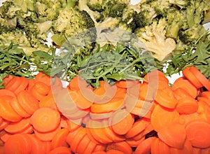 Boiled carrots and broccoli with lettuce. Vegetable side dish, healthy nutrition, diet.