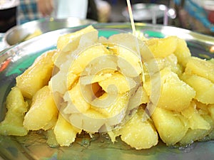 Boiled cassava in syrup.