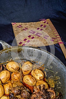 Boiled chicken eggs with chicken liver  on cooking pan.