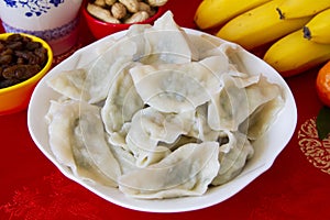 Boiled Chinese dumplings in a plate close up