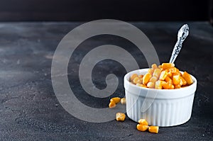 Boiled corn kernels in white cups