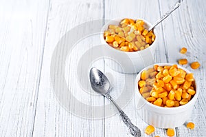 Boiled corn kernels in white cups