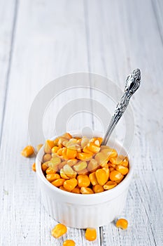 Boiled corn kernels in white cups