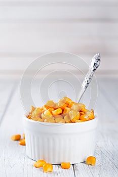 Boiled corn kernels in white cups