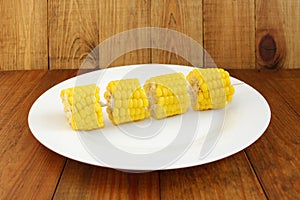 Boiled corns on the wooden background