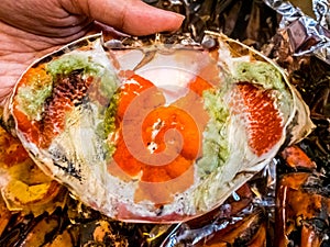Boiled crab fresh and hot - delicious appetizer Steamed crabs and crab`s spawn on aluminium foil Thai seafood, steamed crab showin
