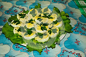 Boiled decorative stuffed eggs on a table