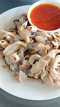 Boiled Duck Intestines Served with Spicy and Sour Sauce.