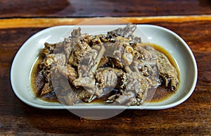 Boiled duck wing stewing in soy sauce Chinese Style on white dish