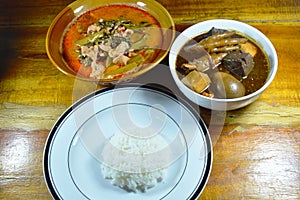 Boiled egg in brown soup and pork with morning glory curry eat couple plain rice