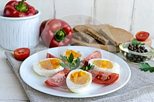 Boiled egg and fresh tomato, black bread - light diet breakfast