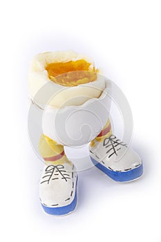 Boiled egg open half with legs isolate
