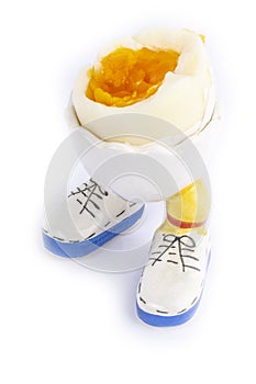 Boiled egg open half with legs isolate