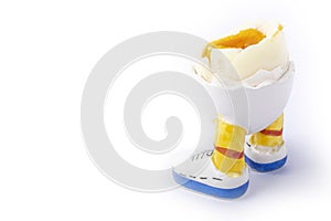 Boiled egg open half with legs isolate